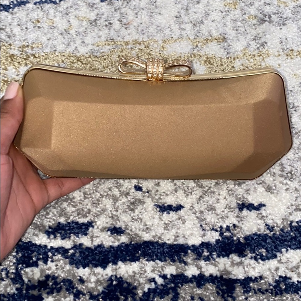Gold / tan clutch.